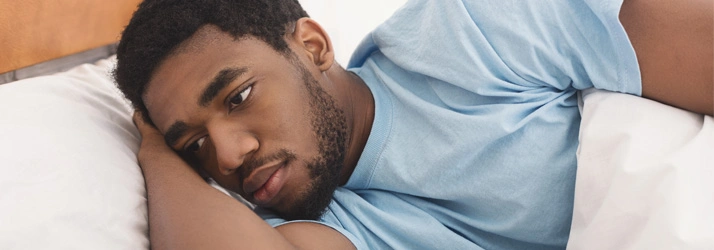 Person lying on a bed